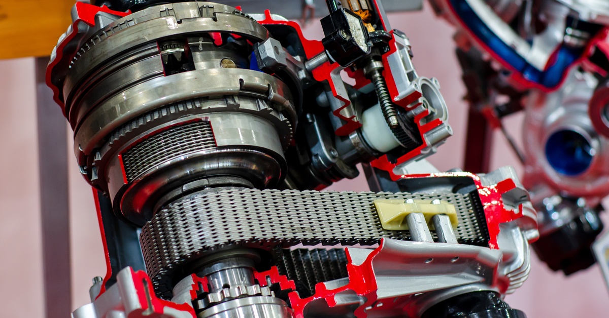 Close-up of a transfer case, which provides a view of its various components, including a belt and gears.