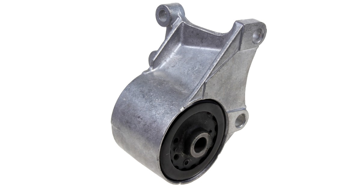 A transmission mount with metal and rubber parts sits against a white background. It is silver and clean.